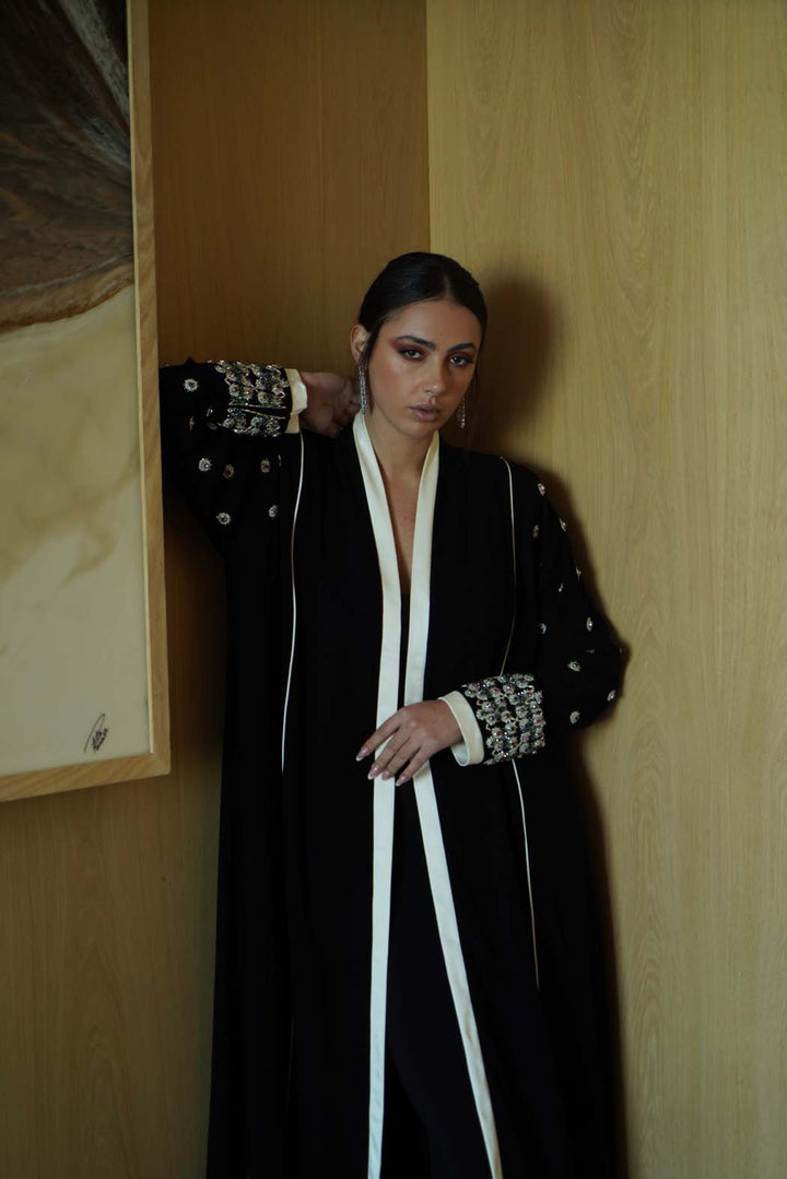Jeweled Elegance: Black Abaya with Multi-Stone Cuffs and White Trim