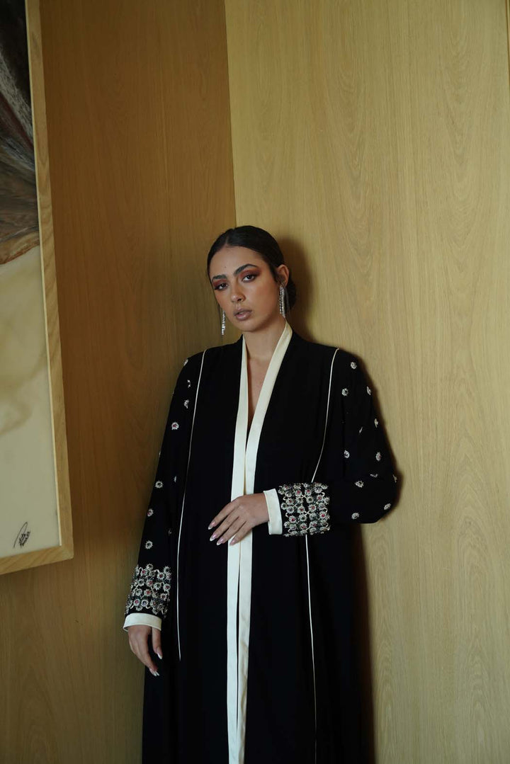 Jeweled Elegance: Black Abaya with Multi-Stone Cuffs and White Trim
