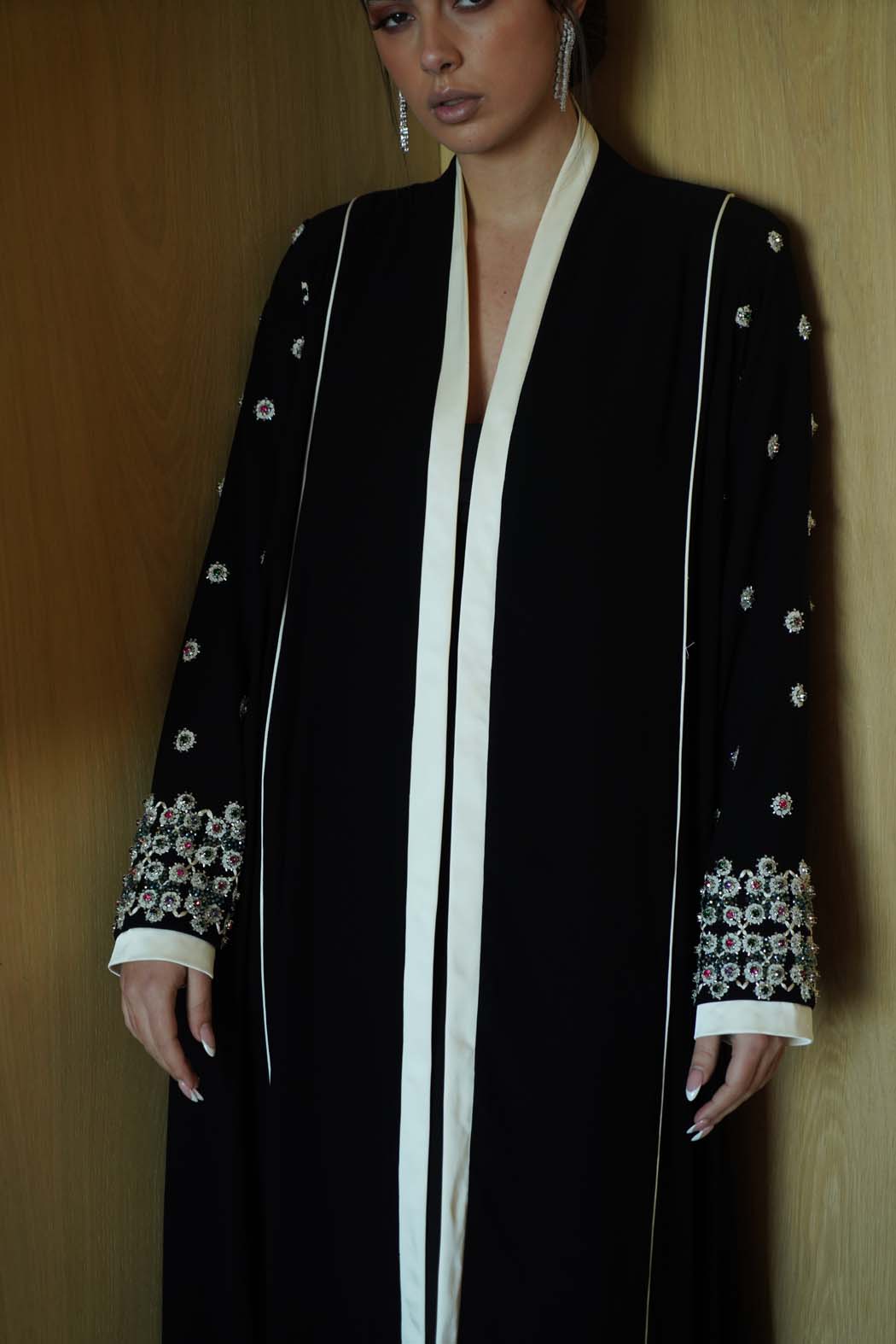 Jeweled Elegance: Black Abaya with Multi-Stone Cuffs and White Trim