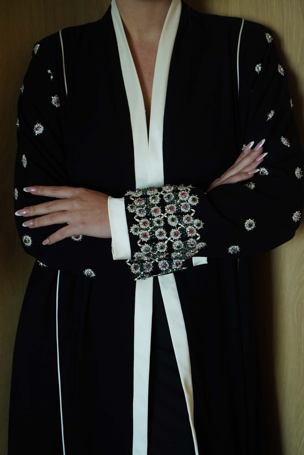 Jeweled Elegance: Black Abaya with Multi-Stone Cuffs and White Trim