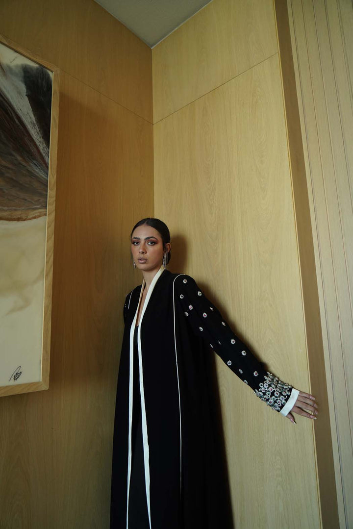 Jeweled Elegance: Black Abaya with Multi-Stone Cuffs and White Trim