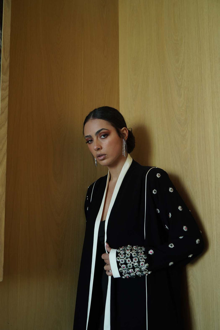 Jeweled Elegance: Black Abaya with Multi-Stone Cuffs and White Trim