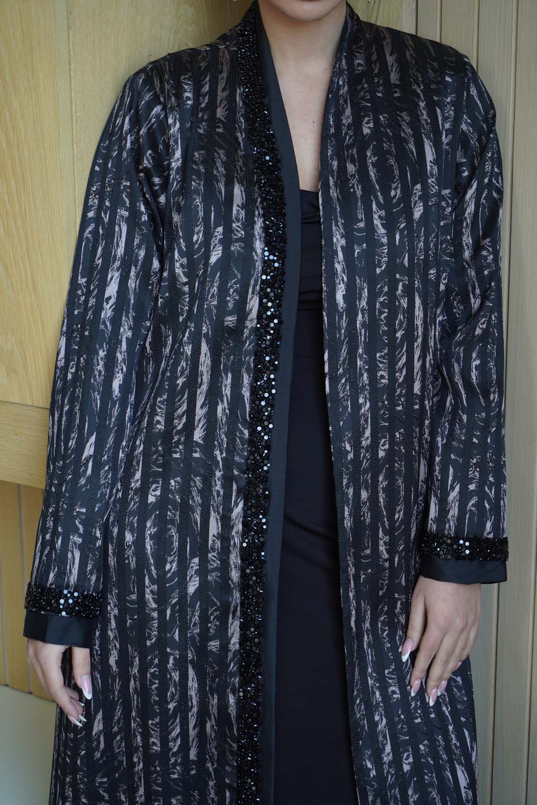 Elegant Abaya with Shimmering Stripes and Black Beaded Details