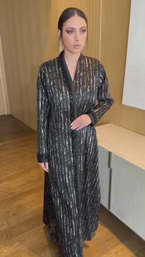 Elegant Abaya with Shimmering Stripes and Black Beaded Details